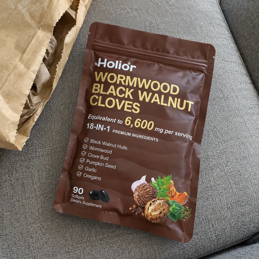 Wormwood Black Walnut Cloves pouch beside an open mailer
